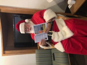 Picture of santa reading Tallulah's Flying Adventure